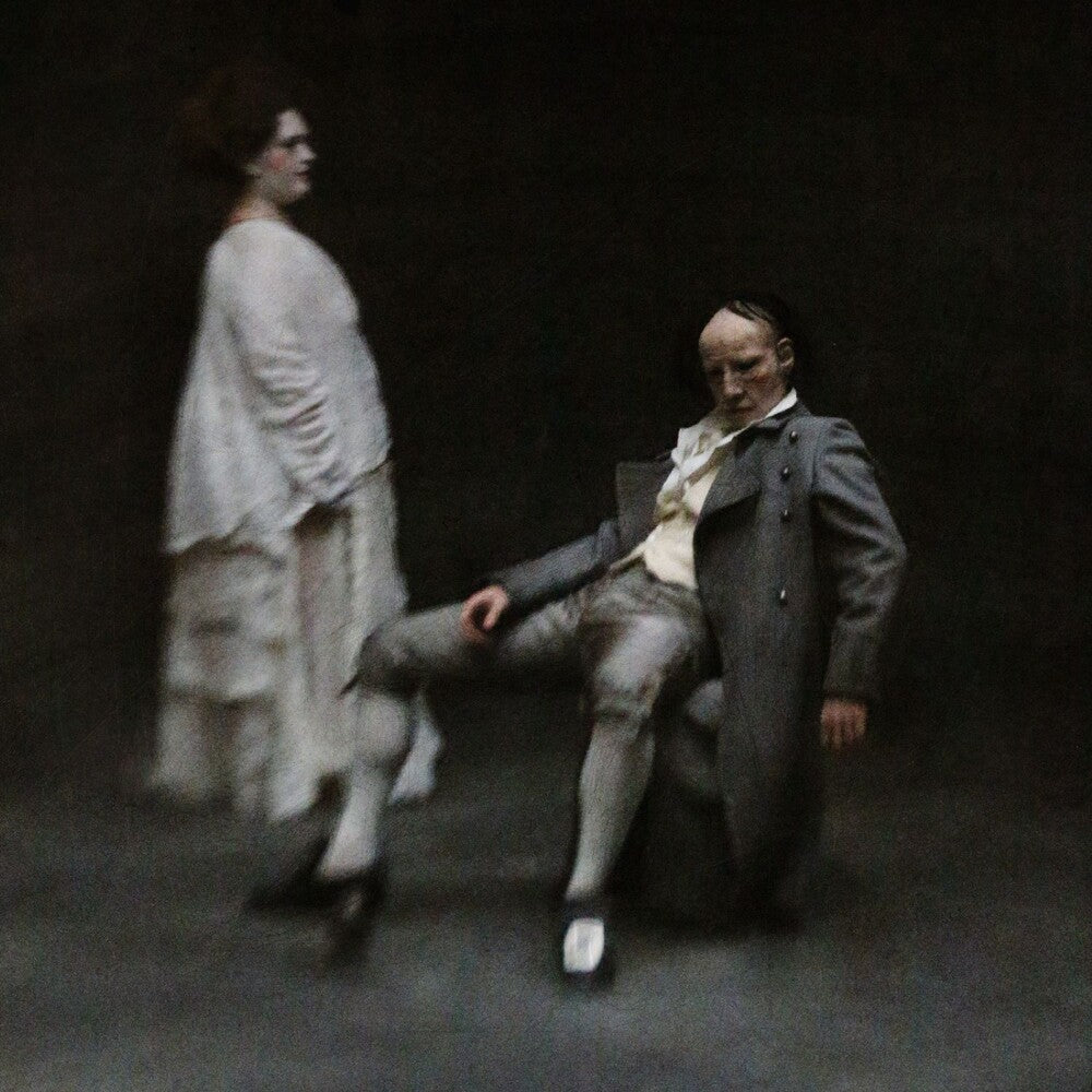 the album cover for HMLTD - FANGS [Indie Exclusive A & B Side Mix Black & Ivory]